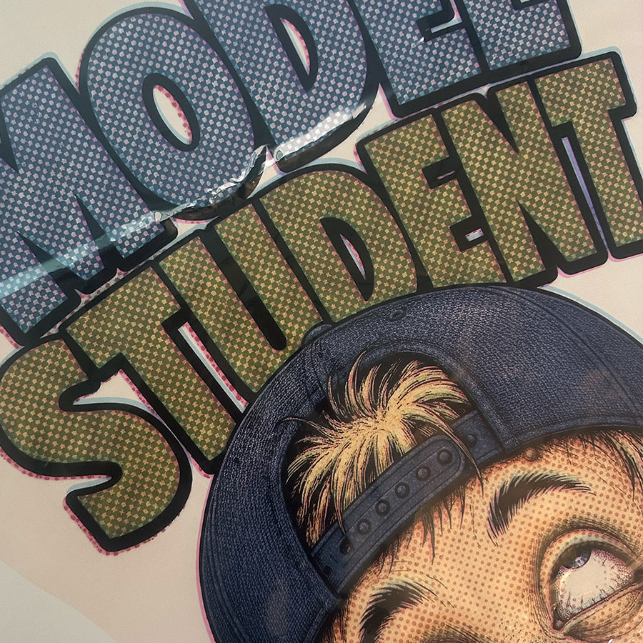 Model Student supersized decal print lettering and cap close-up